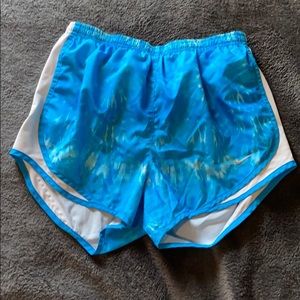 Blue Nike running shorts